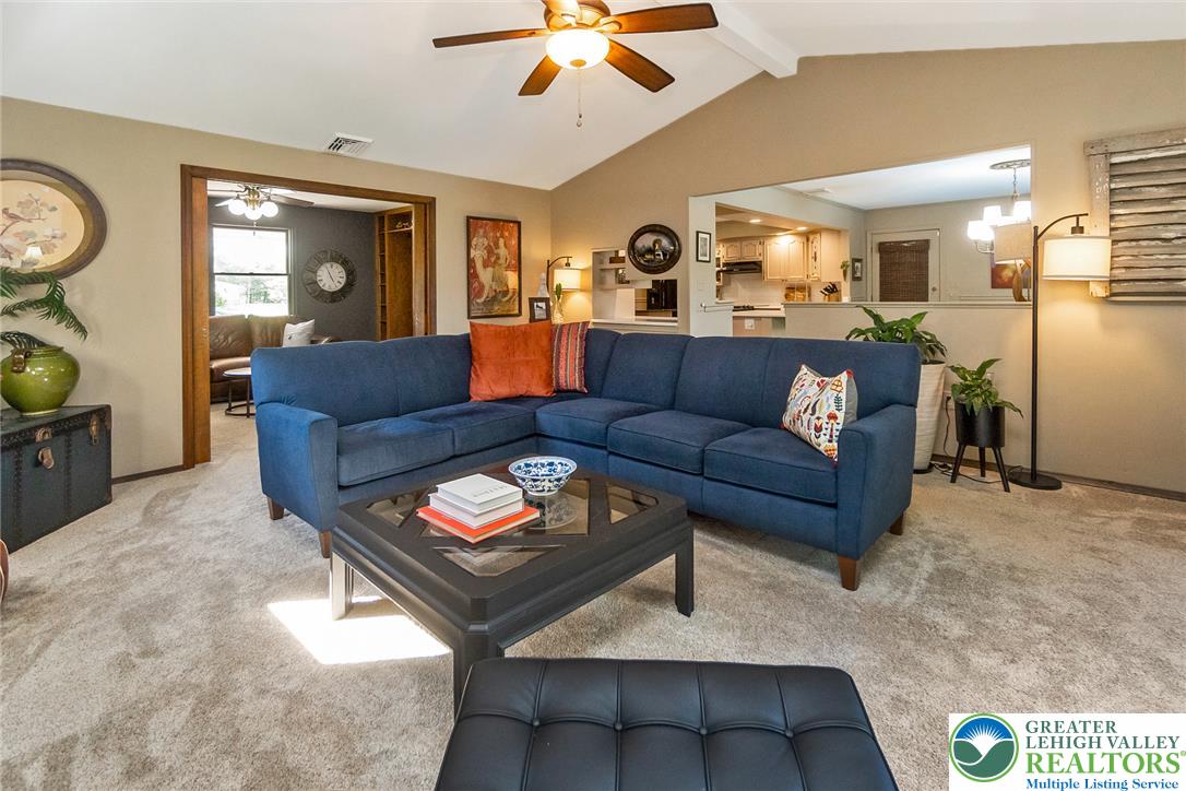 540 Briar Road Pen Argyl, PA 18072 - Photo 14 of 66 An inviting Living room showcasing vaulted ceilings, recessed lighting, and soft carpeting.