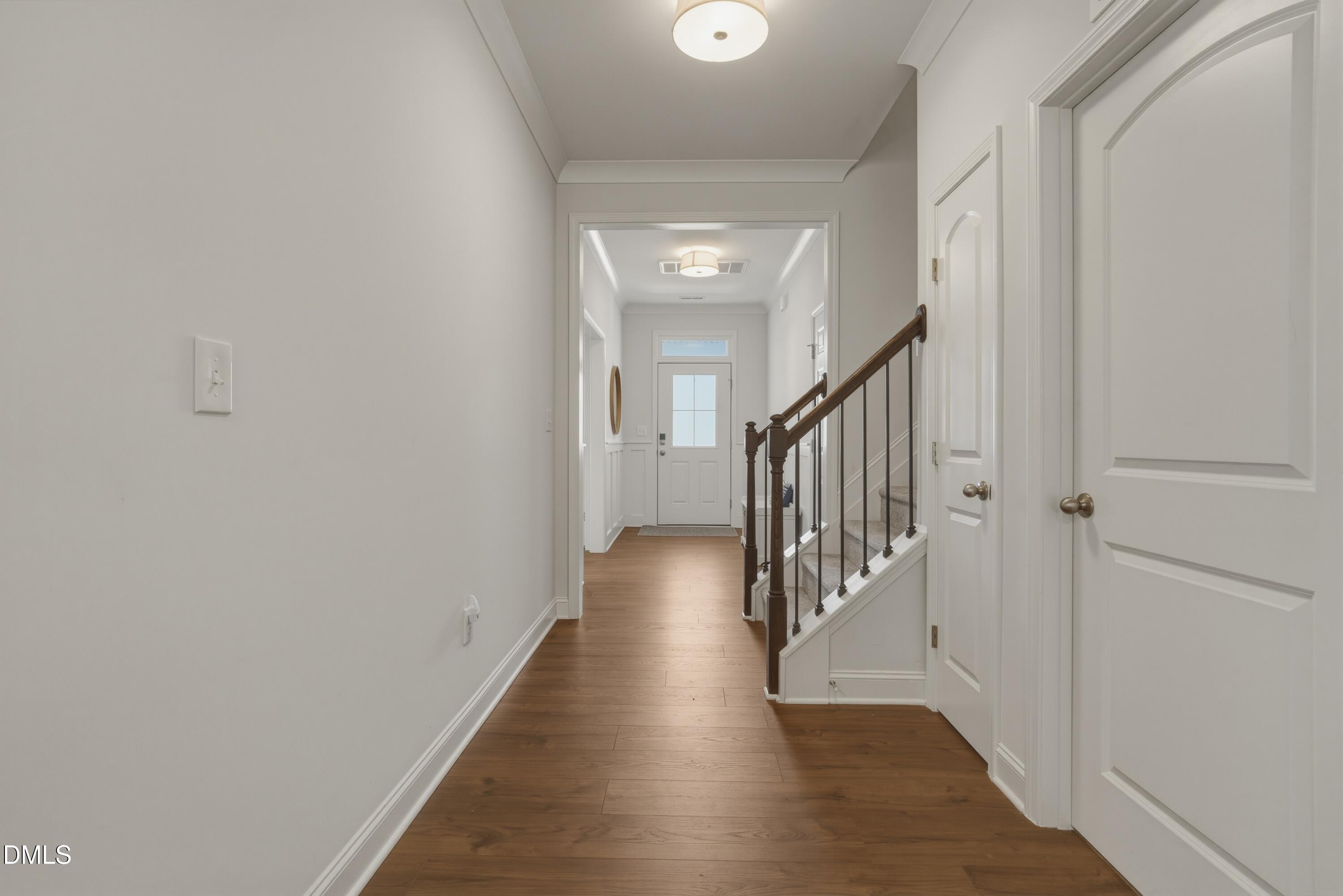 386 Howards Crossing Drive Wendell, NC 27591 - Photo 5 of 31 a view of a hallway with the wooden floor