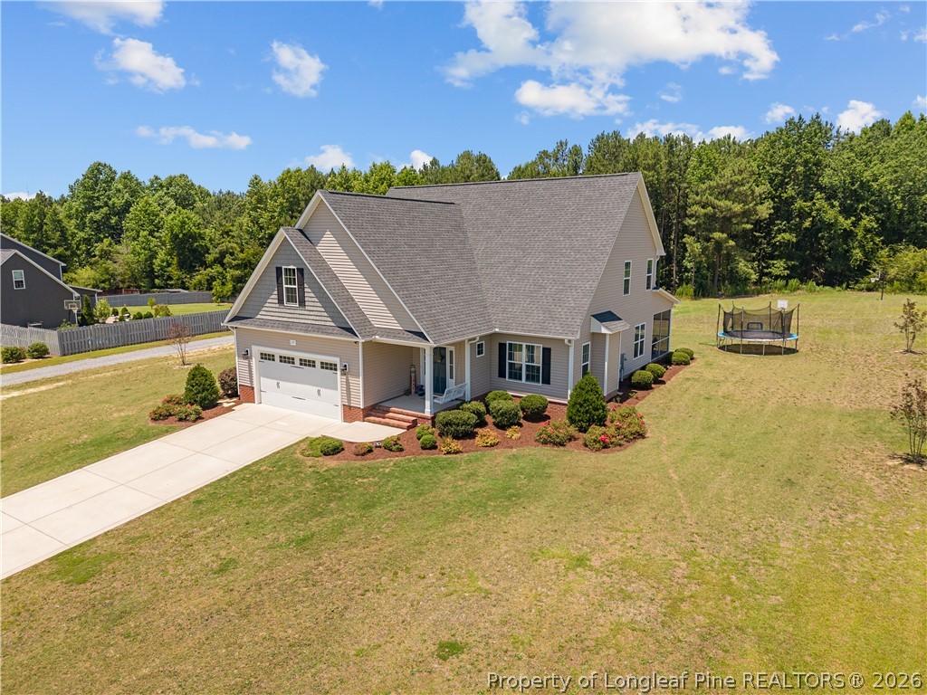 137 Minter School Road Sanford, NC 27332 - Photo 45 of 50 a view of a house with swimming pool and sitting area