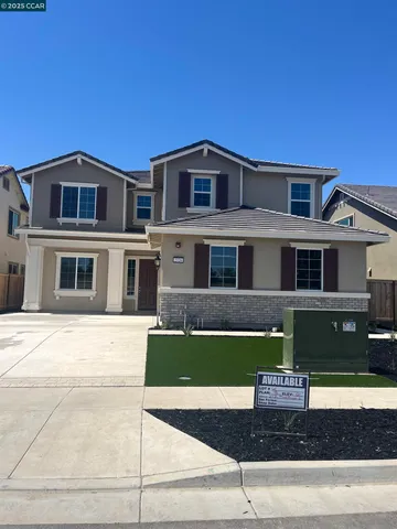 a front view of a house with garage