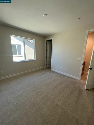 a spacious bathroom with a double vanity sink toilet and a mirror