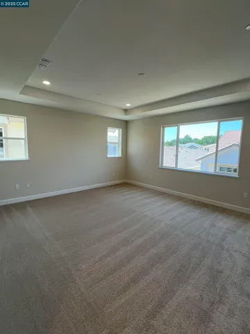 a living room with a couch and a window