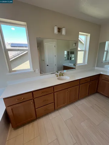 a bathroom with a tub and a sink
