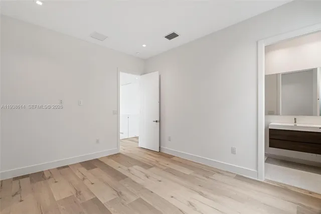 a view of a porch with a table and chairs