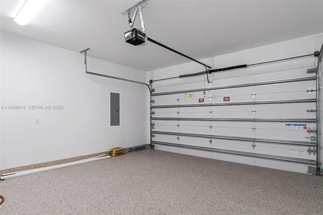 a view of a house with a yard and potted plants