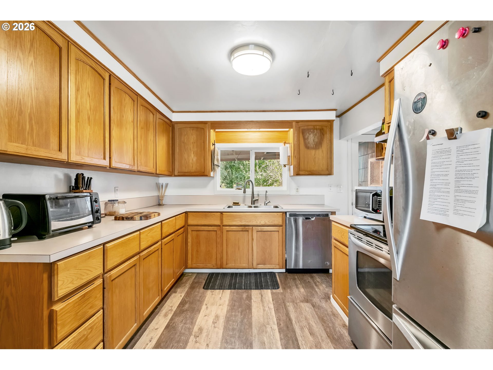 47576 Riverview Street Oakridge, OR 97463 - Photo 12 of 48 a kitchen with a sink stove and refrigerator