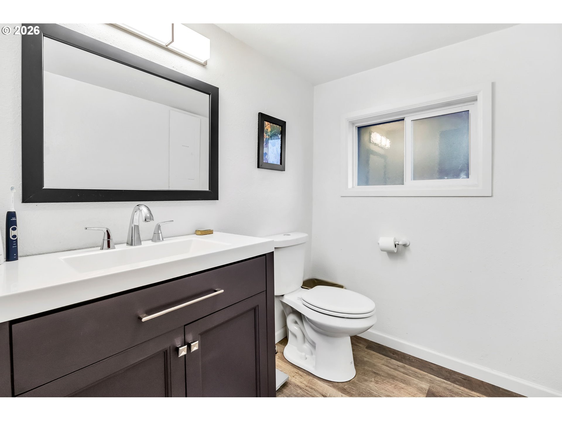 47576 Riverview Street Oakridge, OR 97463 - Photo 29 of 48 a bathroom with a granite countertop toilet sink and mirror