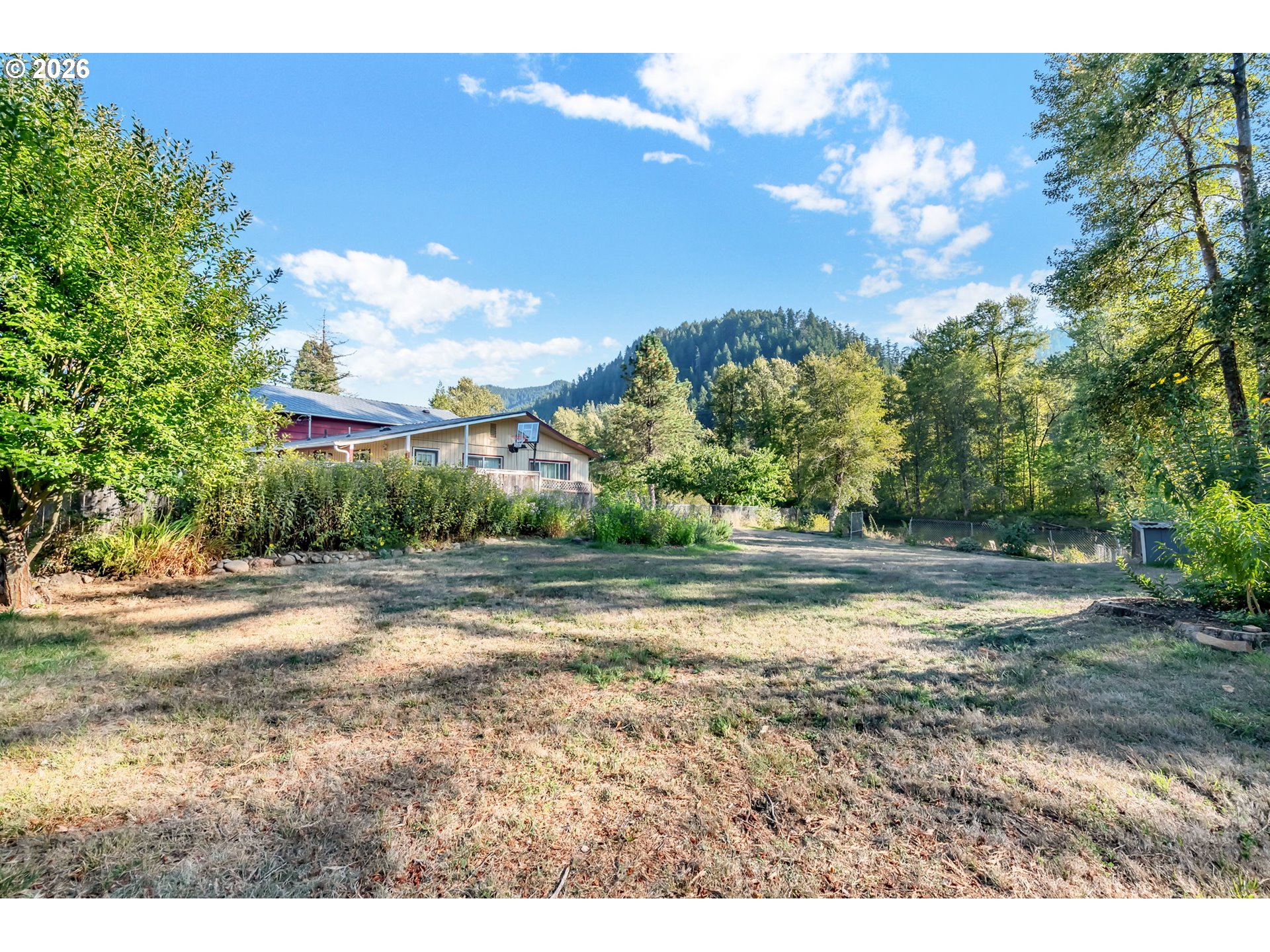 47576 Riverview Street Oakridge, OR 97463 - Photo 36 of 48 a view of a yard and mountain view