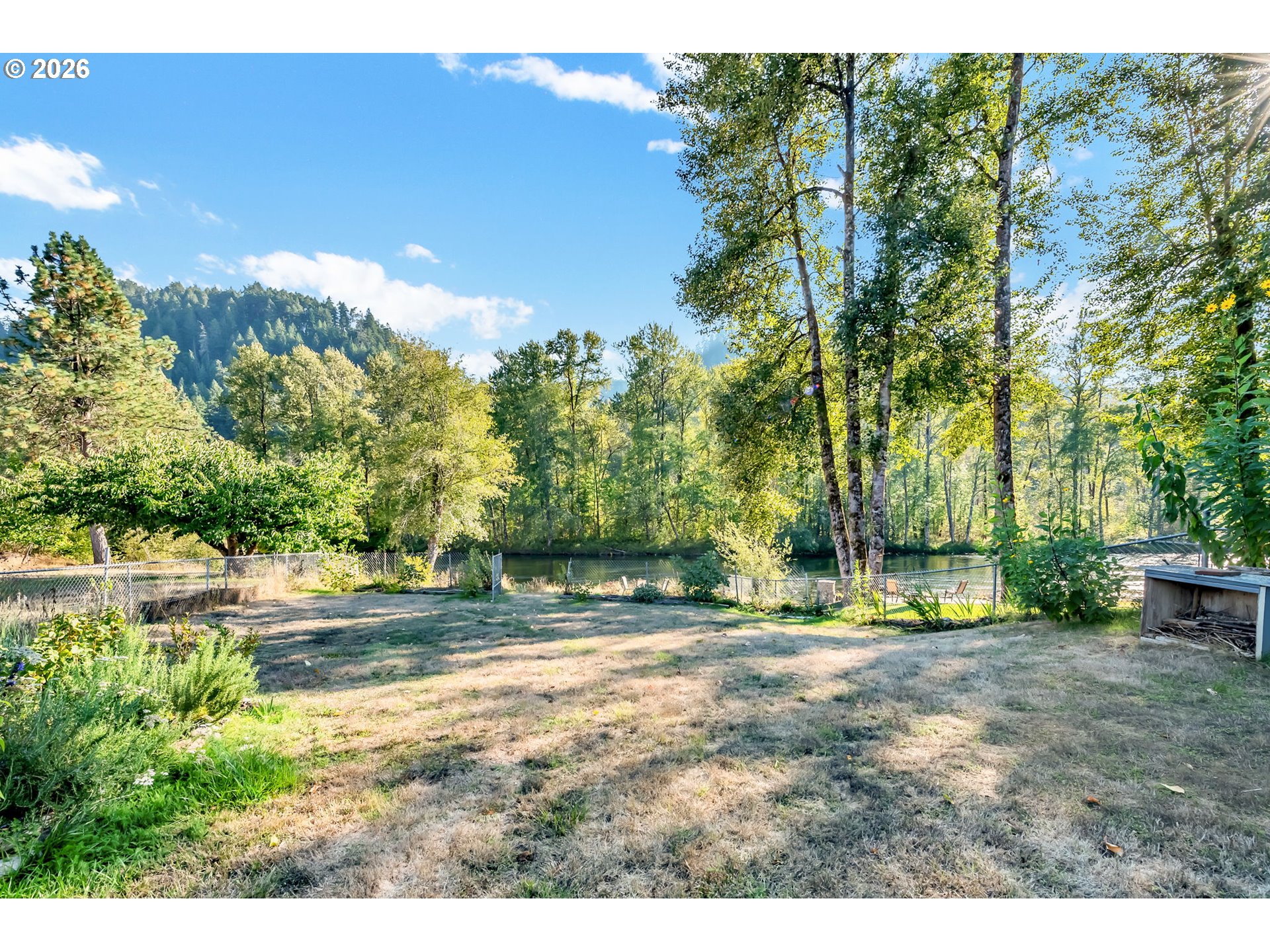 47576 Riverview Street Oakridge, OR 97463 - Photo 37 of 48 a backyard of a house with table and chairs