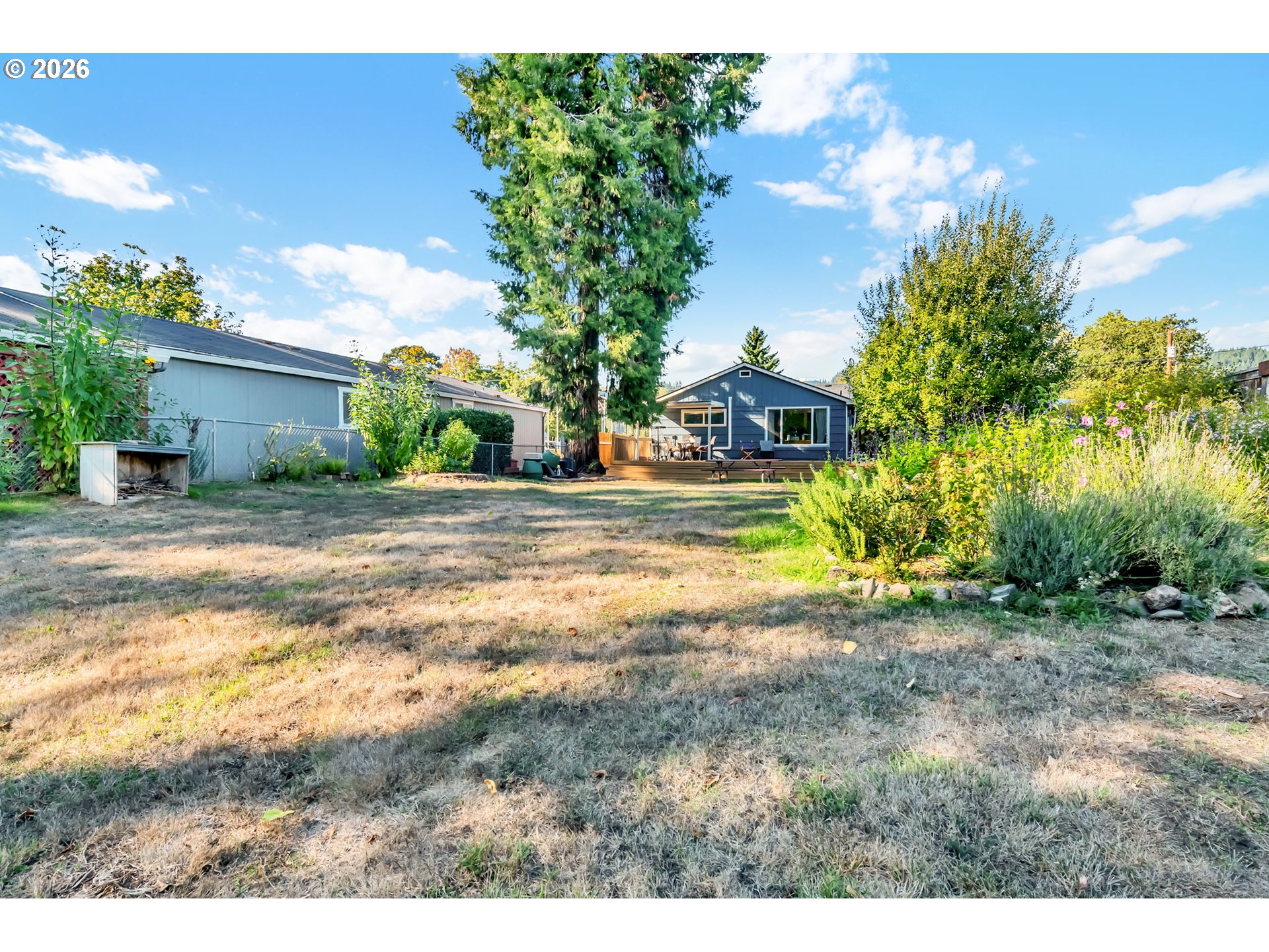 47576 Riverview Street Oakridge, OR 97463 - Photo 39 of 48 a view of a house with backyard and tree s