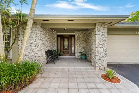 a view of house with swimming pool and patio