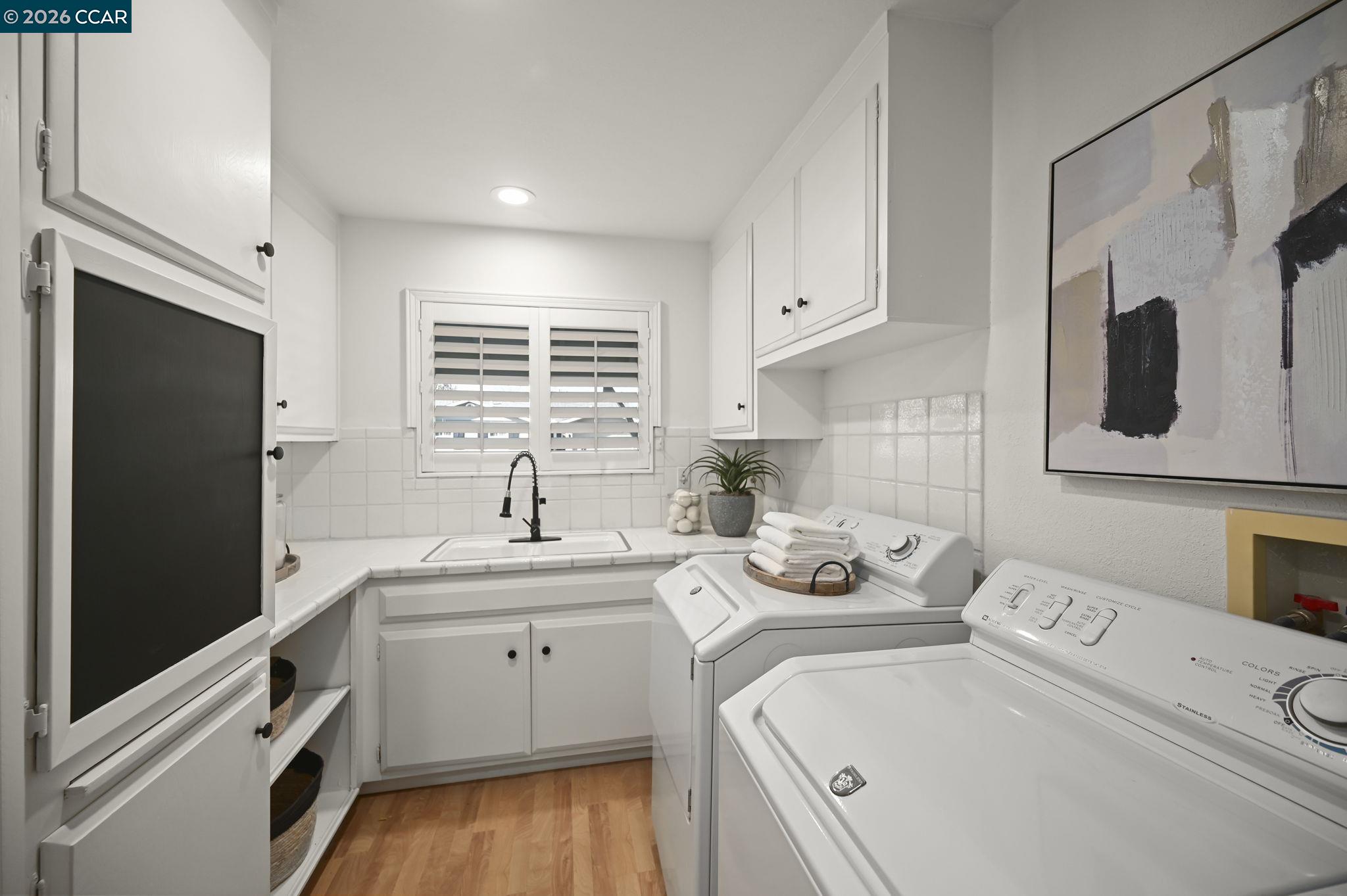 118 Neptune Place San Ramon, CA 94583 - Photo 20 of 36 a kitchen with a sink stove and cabinets
