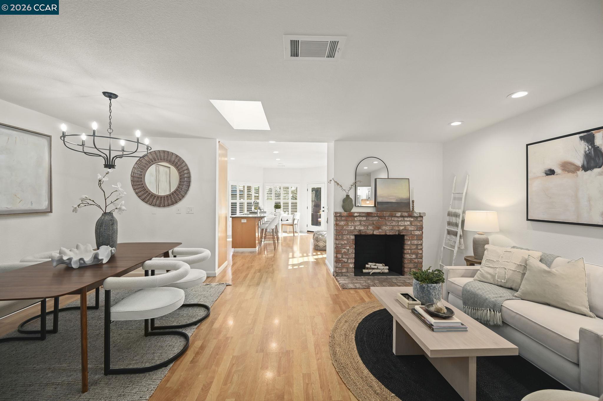 118 Neptune Place San Ramon, CA 94583 - Photo 2 of 36 a living room with furniture a fireplace and a table