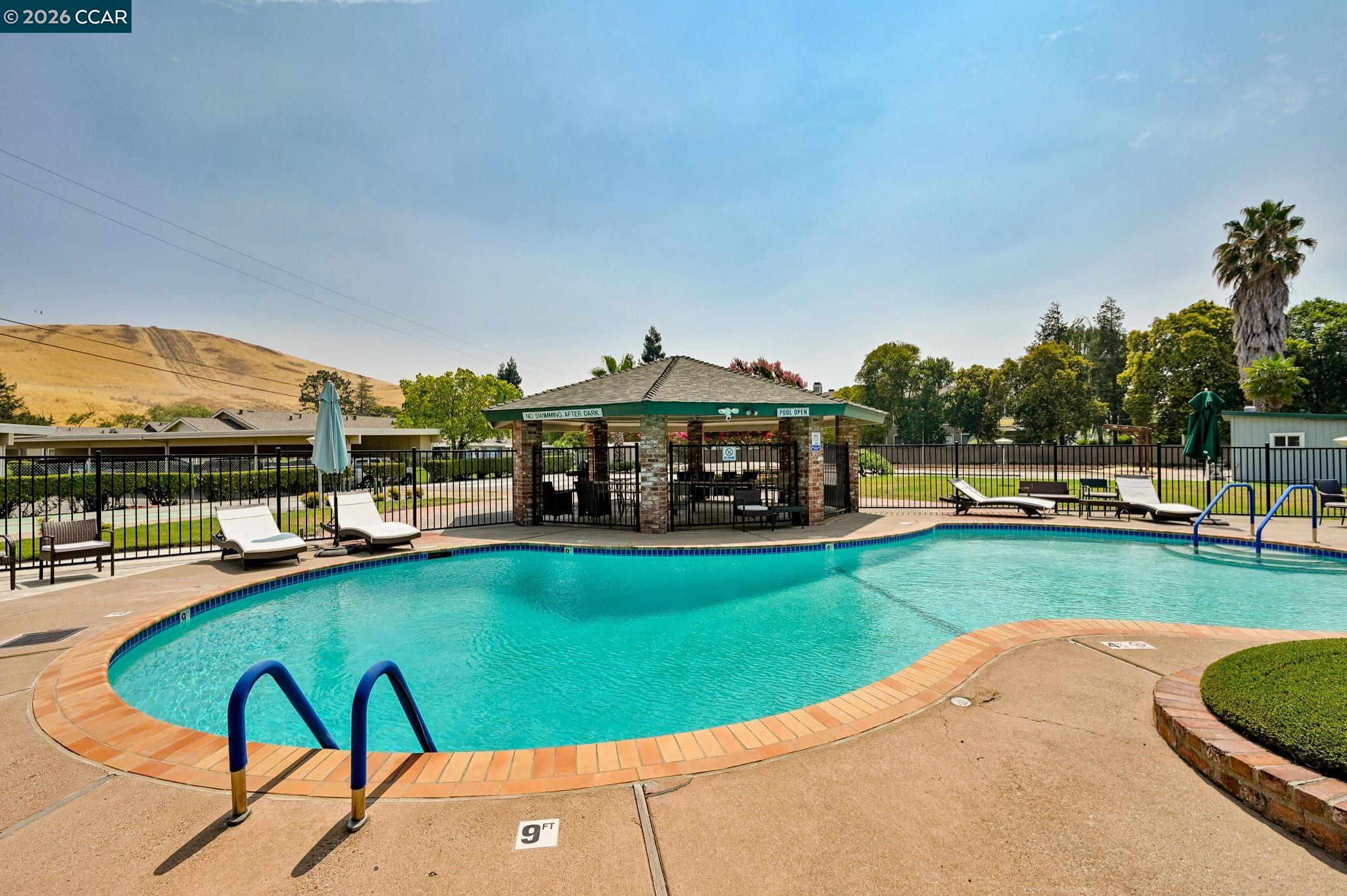 118 Neptune Place San Ramon, CA 94583 - Photo 28 of 36 a view of a swimming pool and lounge chairs