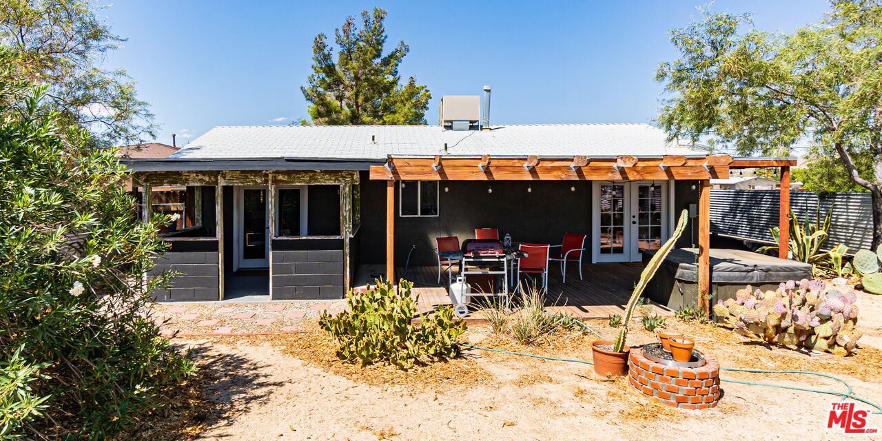 62033 Bonair Road Joshua Tree, CA 92252 - Photo 26 of 53 a view of a chairs and table in a patio