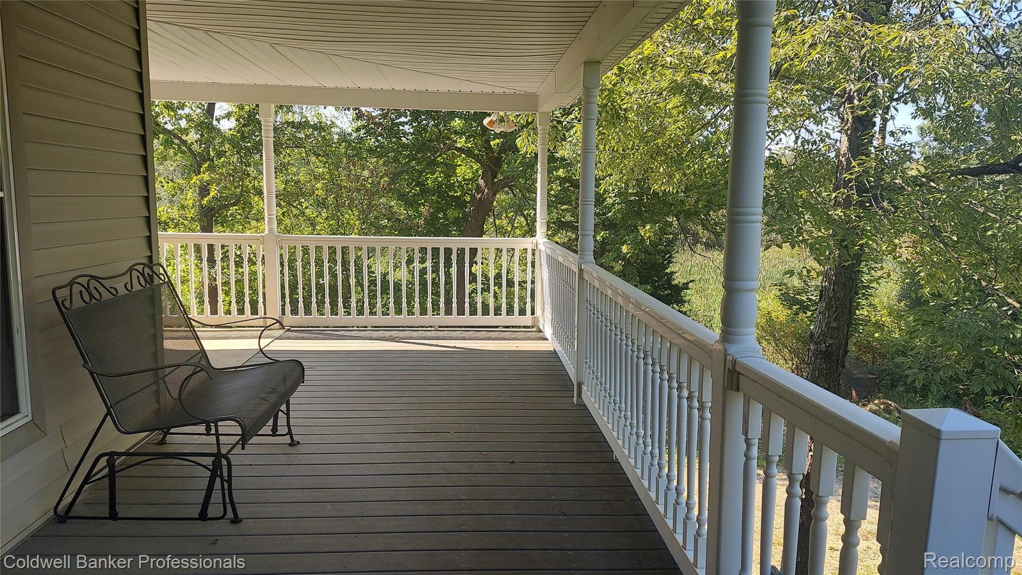 997 South Garner Road Milford, MI 48380 - Photo 3 of 43 Large wrap around porch.