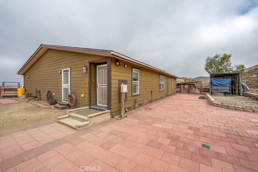 33330 Palen Road Agua Dulce, CA 91390 - Photo 31 of 56 a view of a house with a patio