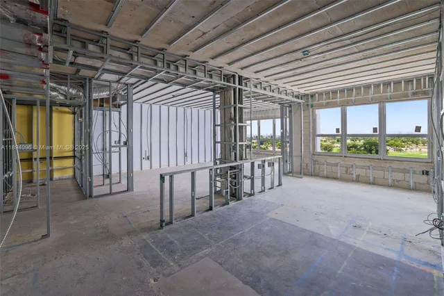 a large kitchen with stainless steel appliances granite countertop a stove and a refrigerator