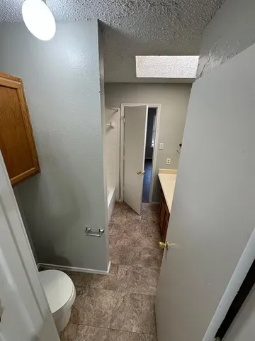 a bathroom with a sink and toilet