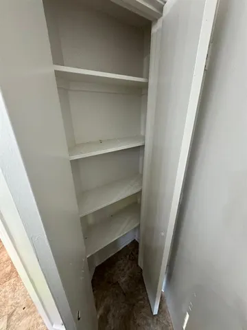 a storage room with washer and dryer