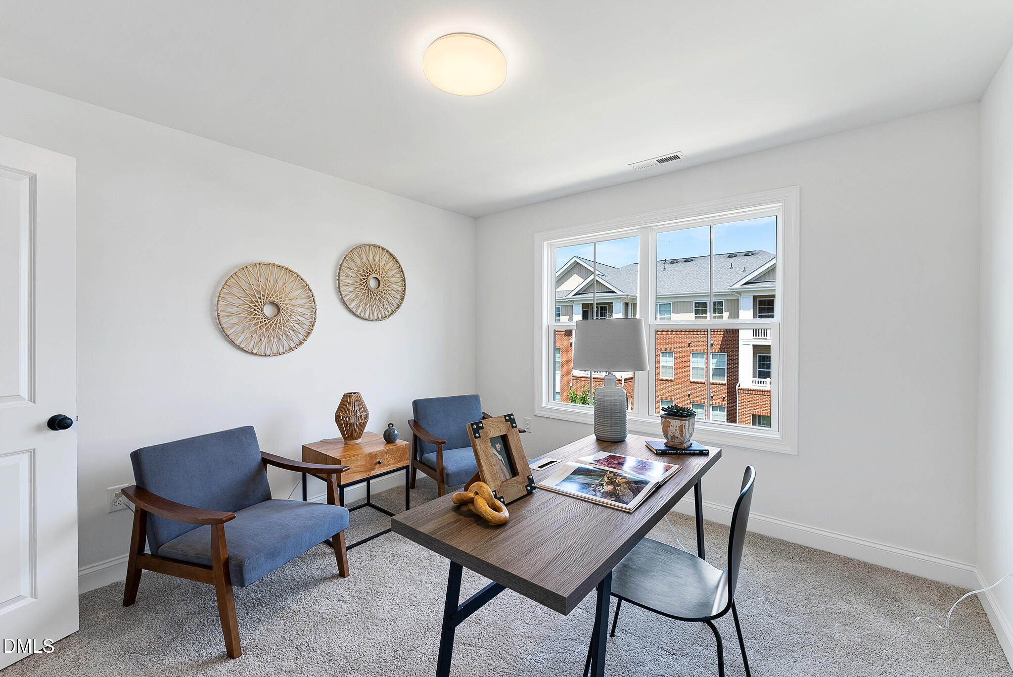 4821 Gossamer Lane, Unit 103 Raleigh, NC 27616 - Photo 20 of 46 a workspace with furniture and a window