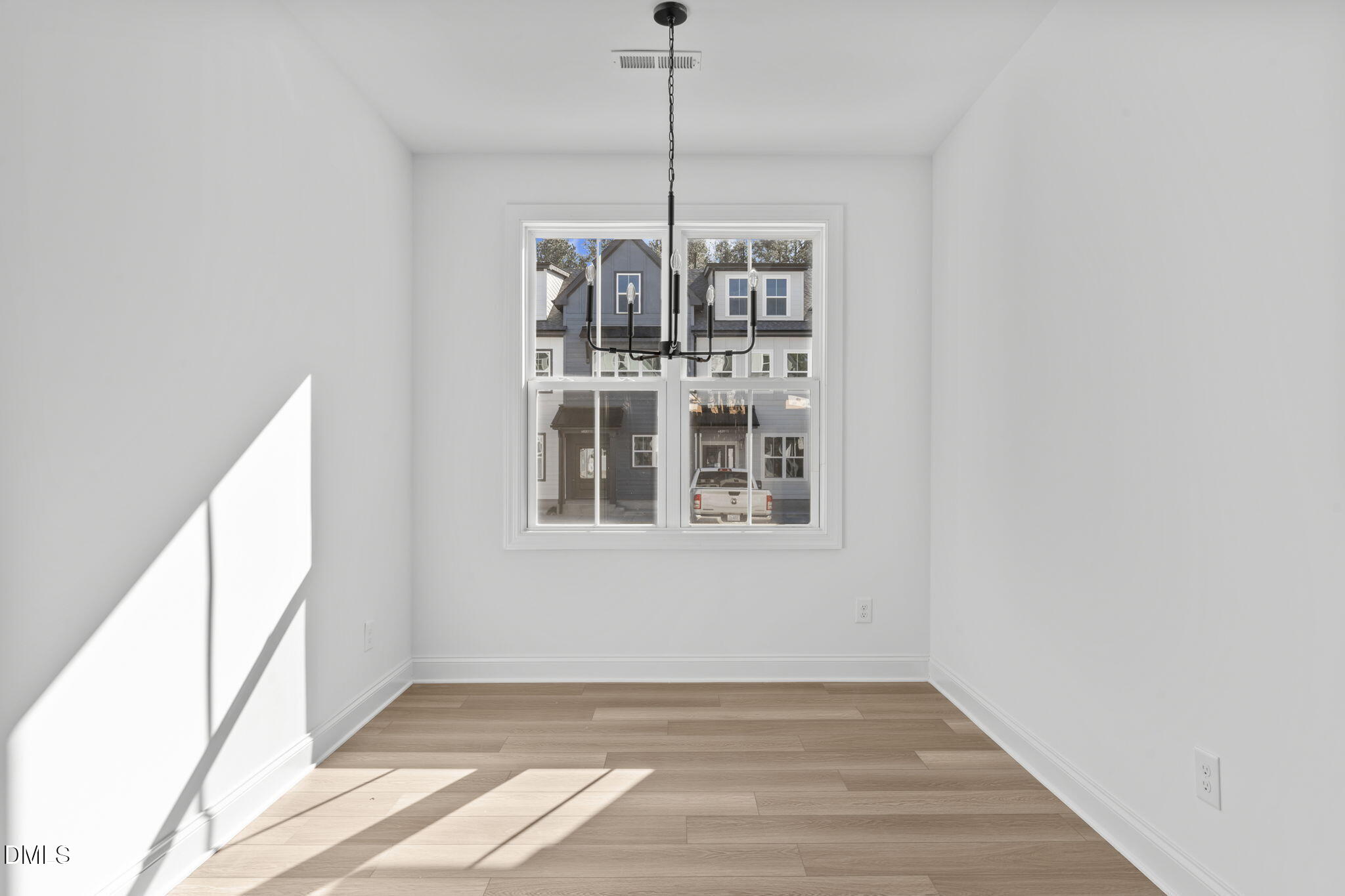 4821 Gossamer Lane, Unit 103 Raleigh, NC 27616 - Photo 6 of 46 a view of a room with windows