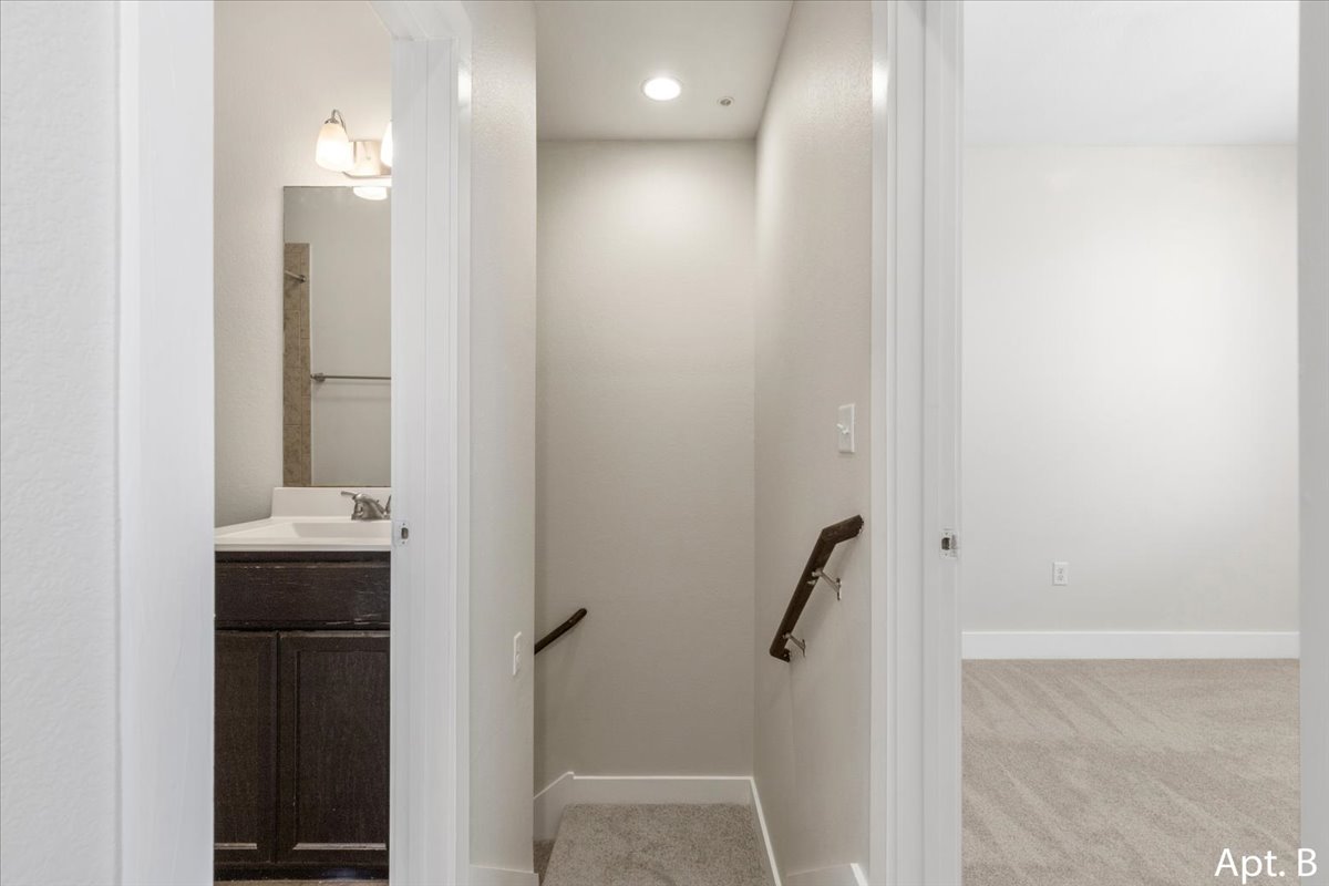 2225 Katy Lane, Unit B Georgetown, TX 78626 - Photo 13 of 22 Stairway with carpet floors and recessed lighting