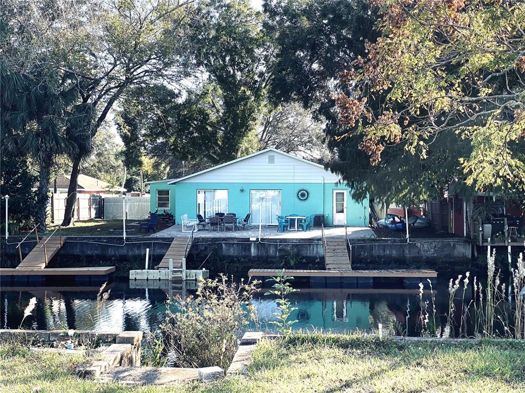 6265 Fine Street Weeki Wachee, FL 34607 - Photo 1 of 1 a front view of house with yard and trees around