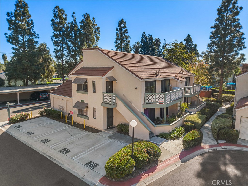 a aerial view of a house with a yard