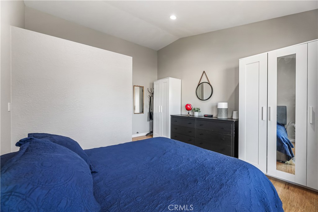 3512 West Stonepine Lane, Unit D Anaheim, CA 92804 - Photo 14 of 38 a bed room with a bed and a mirror