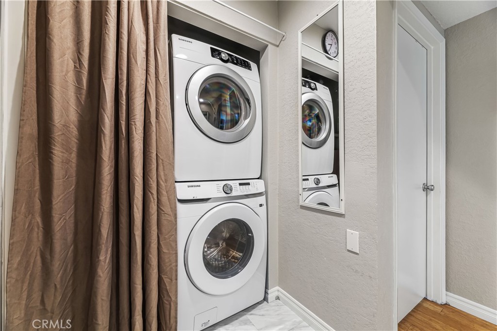 3512 West Stonepine Lane, Unit D Anaheim, CA 92804 - Photo 18 of 38 a view of a hallway with washer and dryer
