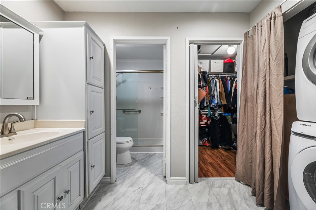 3512 West Stonepine Lane, Unit D Anaheim, CA 92804 - Photo 19 of 38 a bathroom with a toilet sink and shower