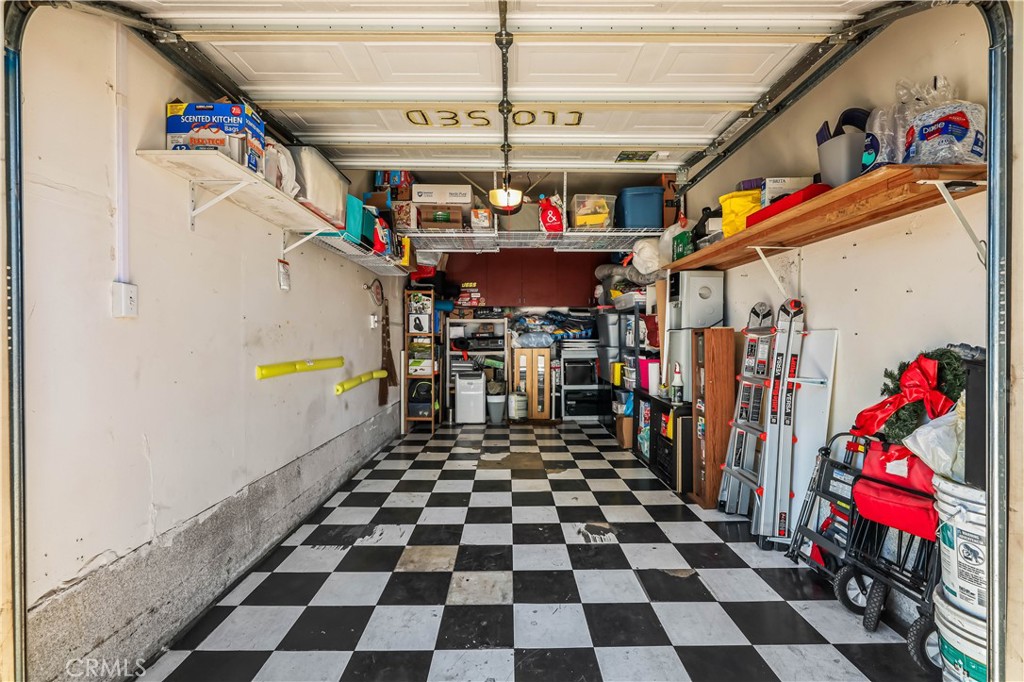 3512 West Stonepine Lane, Unit D Anaheim, CA 92804 - Photo 25 of 38 a storage room with a stove and a refrigerator