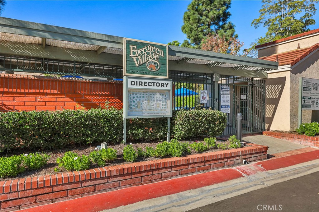 3512 West Stonepine Lane, Unit D Anaheim, CA 92804 - Photo 30 of 38 a front view of a building with garden