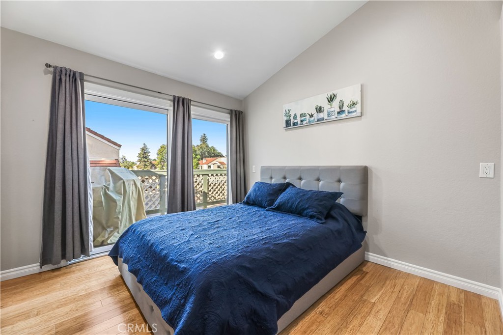 3512 West Stonepine Lane, Unit D Anaheim, CA 92804 - Photo 3 of 38 a bed sitting in a bedroom next to a window