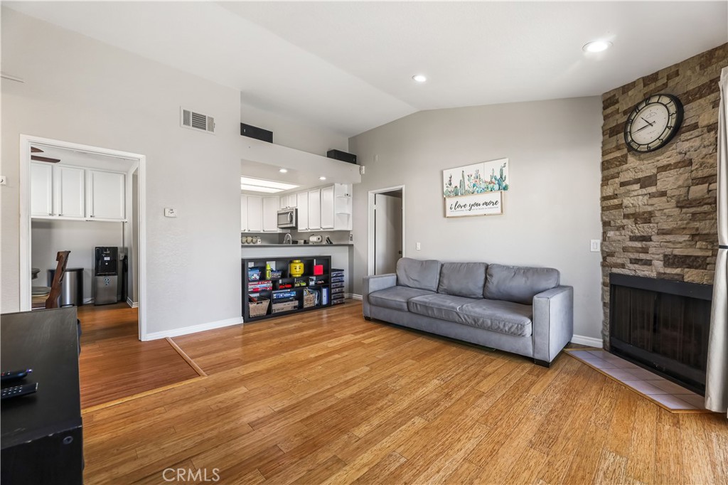 3512 West Stonepine Lane, Unit D Anaheim, CA 92804 - Photo 6 of 38 a living room with furniture and a fireplace