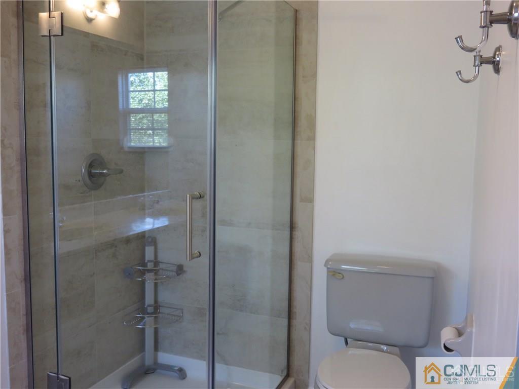 387 Draco Road, Unit 387 Piscataway, NJ 08854 - Photo 14 of 17 a bathroom with a toilet and a shower