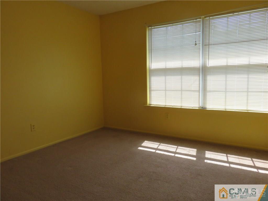387 Draco Road, Unit 387 Piscataway, NJ 08854 - Photo 15 of 17 an empty room with a window