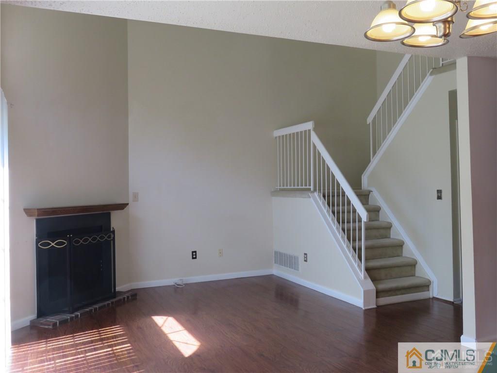 387 Draco Road, Unit 387 Piscataway, NJ 08854 - Photo 4 of 17 a view of entryway and hall with wooden floor