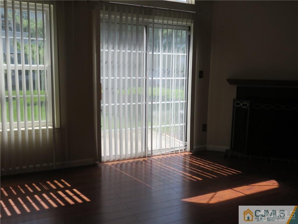 387 Draco Road, Unit 387 Piscataway, NJ 08854 - Photo 5 of 17 a view of wooden floor and windows in a room