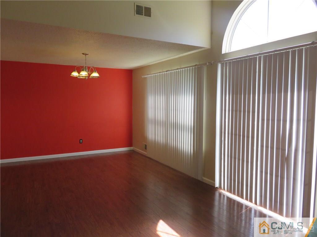 387 Draco Road, Unit 387 Piscataway, NJ 08854 - Photo 8 of 17 a view of an empty room with a window