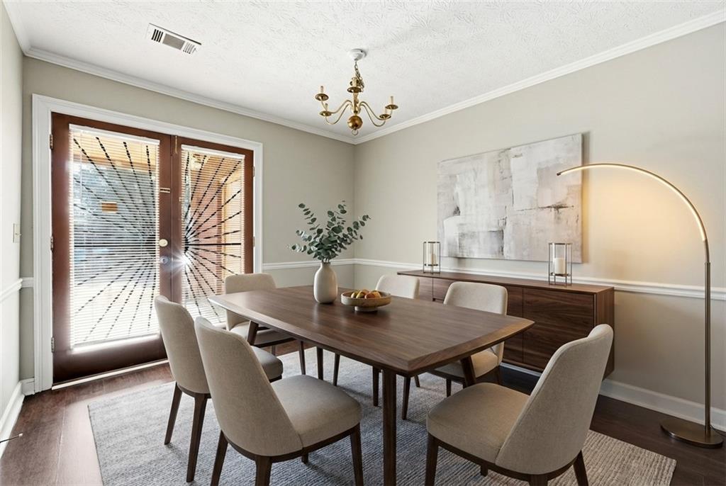 6148 Winfield Court Tucker, GA 30084 - Photo 11 of 27 a view of a dining room with furniture window and wooden floor