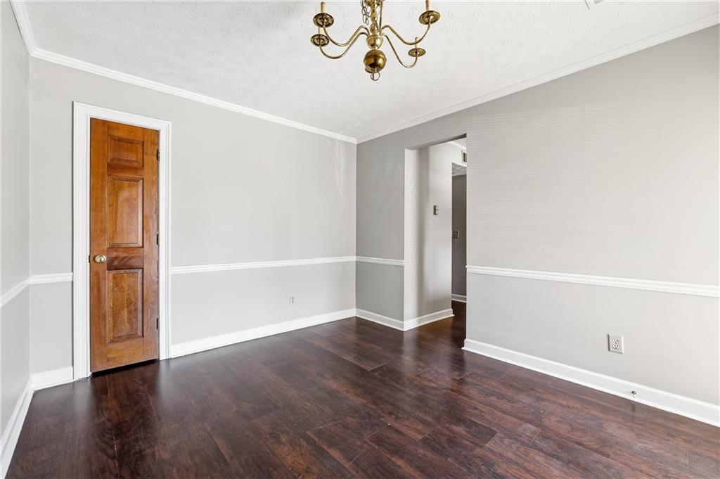 6148 Winfield Court Tucker, GA 30084 - Photo 13 of 27 an empty room with wooden floor and hallway
