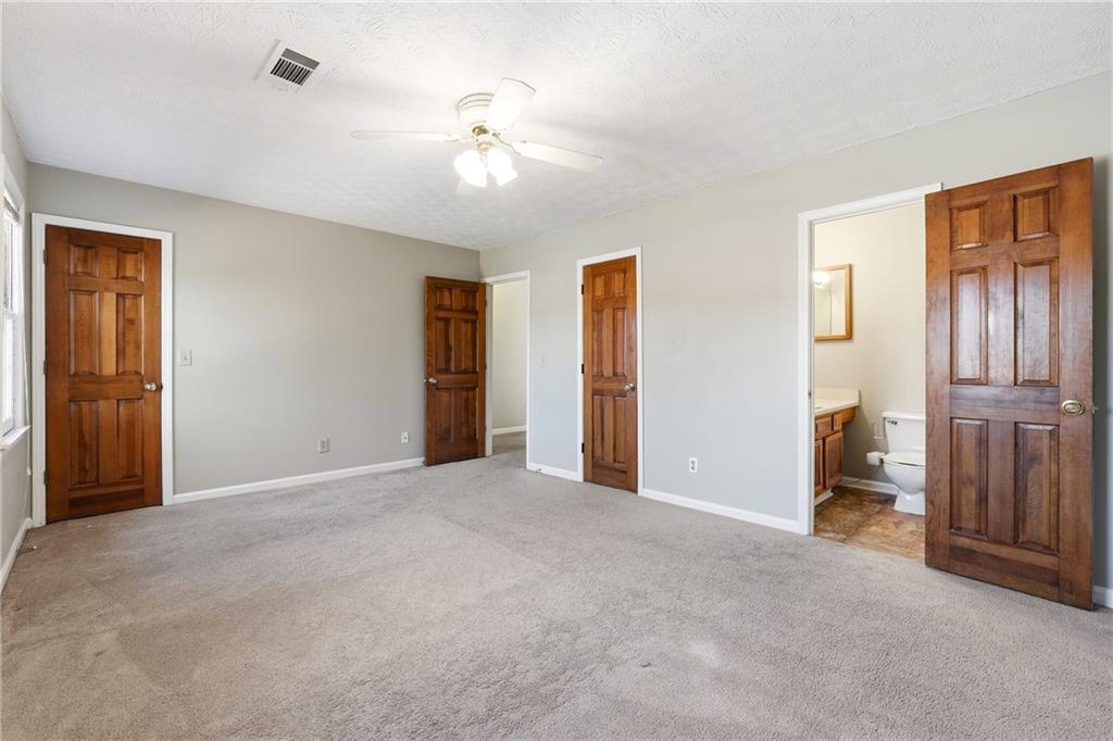 6148 Winfield Court Tucker, GA 30084 - Photo 19 of 27 a view of empty room with wooden floor