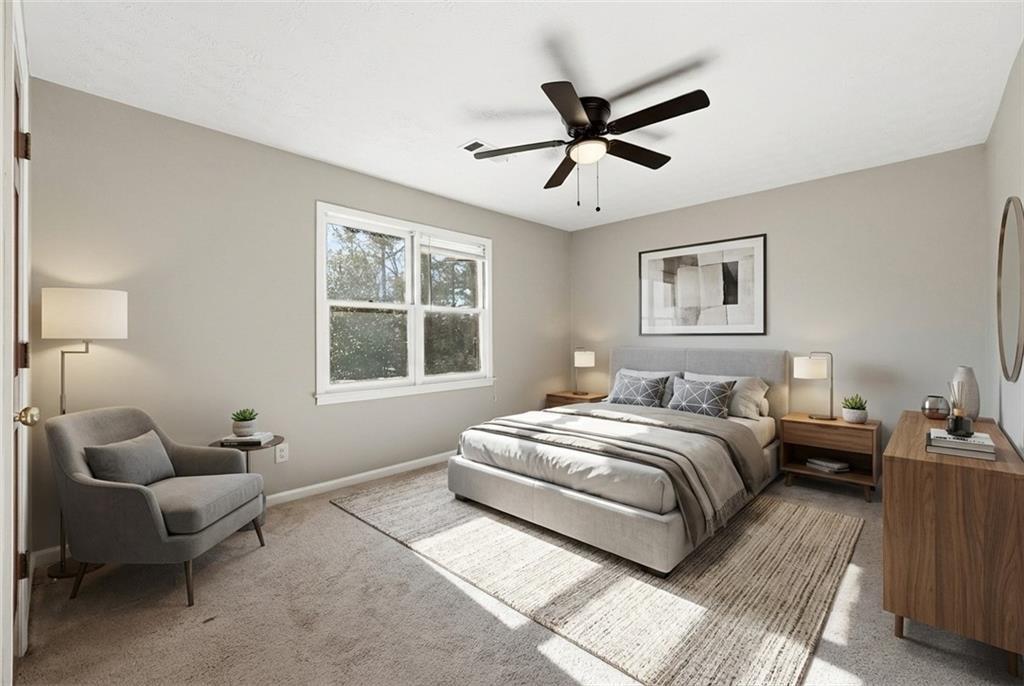 6148 Winfield Court Tucker, GA 30084 - Photo 20 of 27 a bedroom with bed couch and window