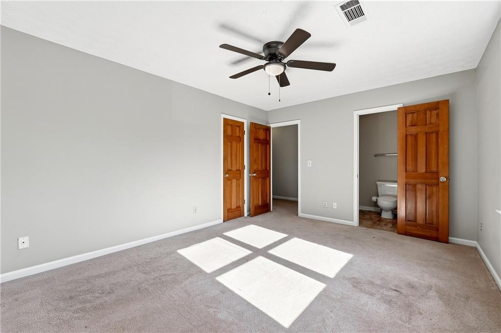 6148 Winfield Court Tucker, GA 30084 - Photo 22 of 27 a view of a livingroom with a ceiling fan and window