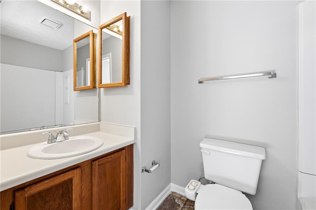 6148 Winfield Court Tucker, GA 30084 - Photo 24 of 27 a bathroom with a sink toilet and vanity