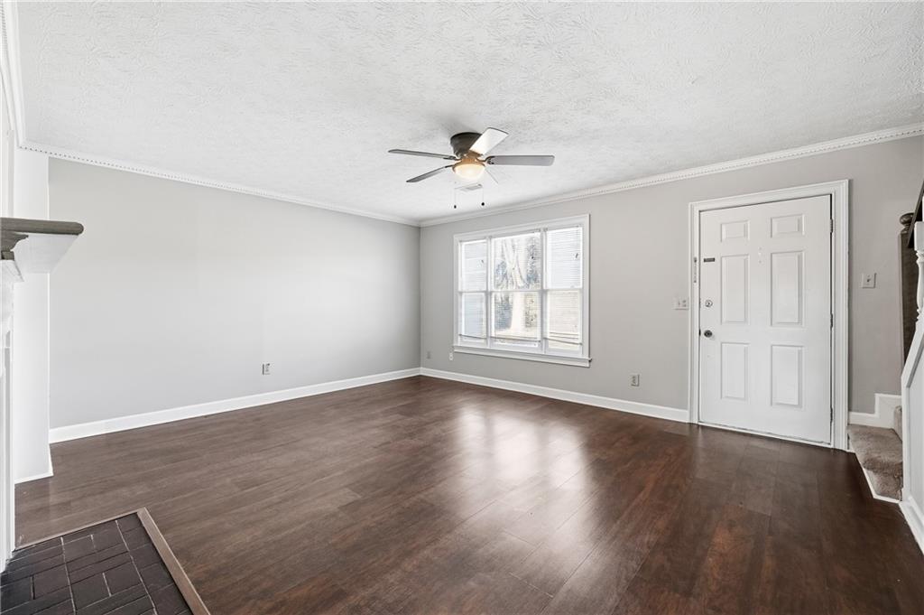 6148 Winfield Court Tucker, GA 30084 - Photo 6 of 27 wooden floor in an empty room with a window