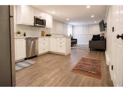 a kitchen with stainless steel appliances kitchen island microwave stove refrigerator and cabinets