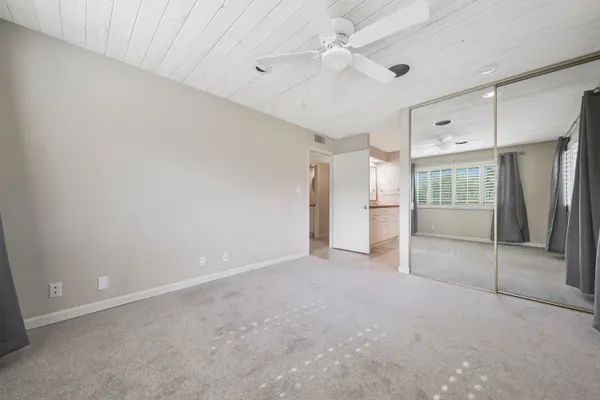 a view of an empty room with a cabinet